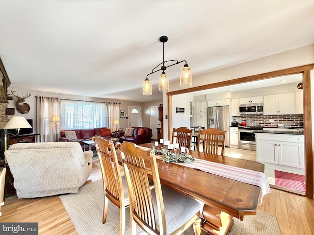 dining room with light wood-type flooring