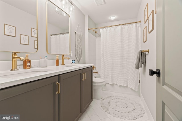 full bath featuring tile patterned flooring, toilet, shower / bath combo with shower curtain, and a sink