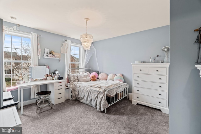 bedroom with a notable chandelier and carpet