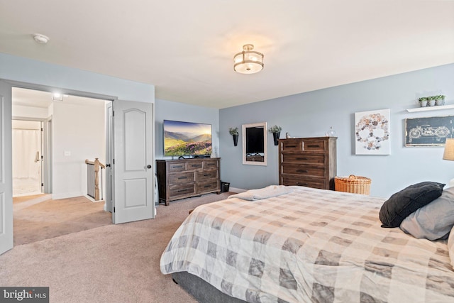 bedroom featuring light colored carpet