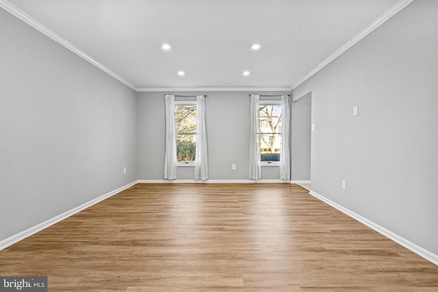 empty room featuring baseboards, recessed lighting, light wood-type flooring, and ornamental molding