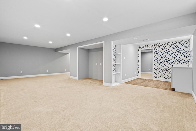 finished below grade area featuring recessed lighting, baseboards, and carpet