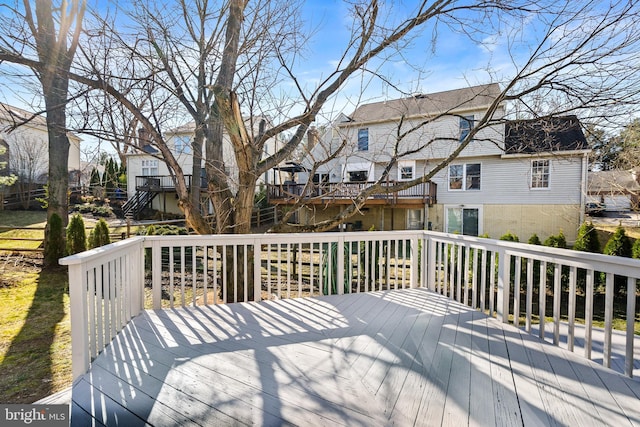 wooden deck with a residential view