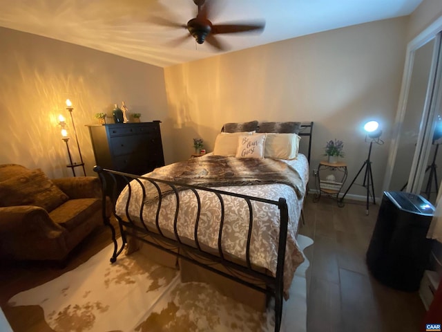 bedroom with wood finished floors and ceiling fan