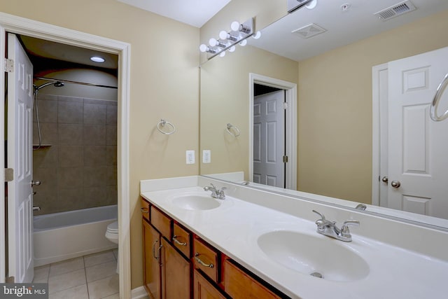 bathroom featuring a sink, visible vents, and tile patterned floors