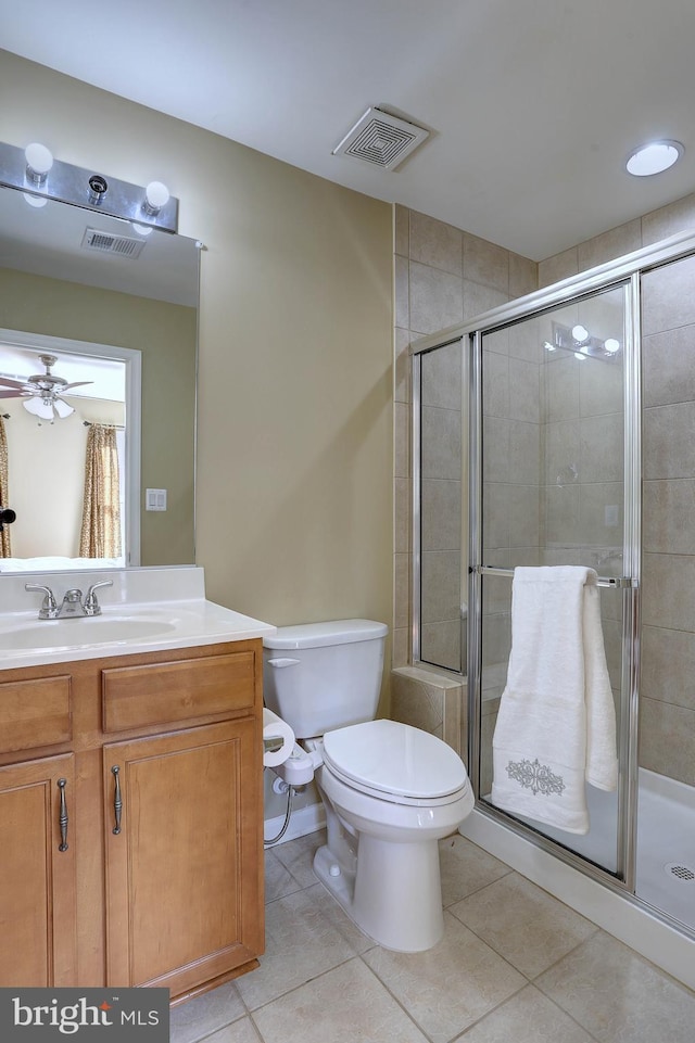 full bathroom featuring tile patterned floors, visible vents, and a shower stall