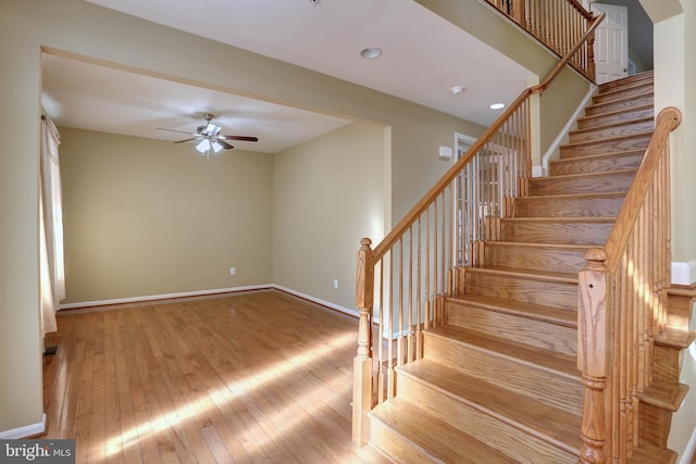 staircase with recessed lighting, baseboards, hardwood / wood-style floors, and a ceiling fan