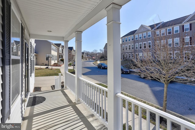 balcony featuring a porch and a residential view