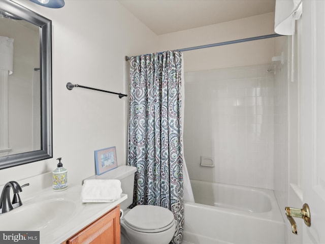 bathroom with toilet, vanity, and shower / bath combination with curtain