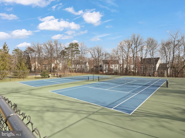 view of tennis court with fence