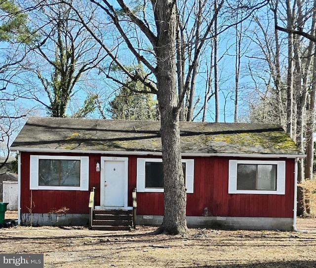 view of front of house with crawl space, entry steps, and roof with shingles