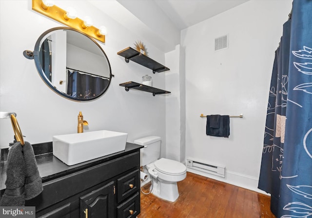 bathroom with visible vents, a baseboard radiator, toilet, vanity, and wood-type flooring