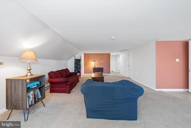 carpeted living room with baseboards and lofted ceiling