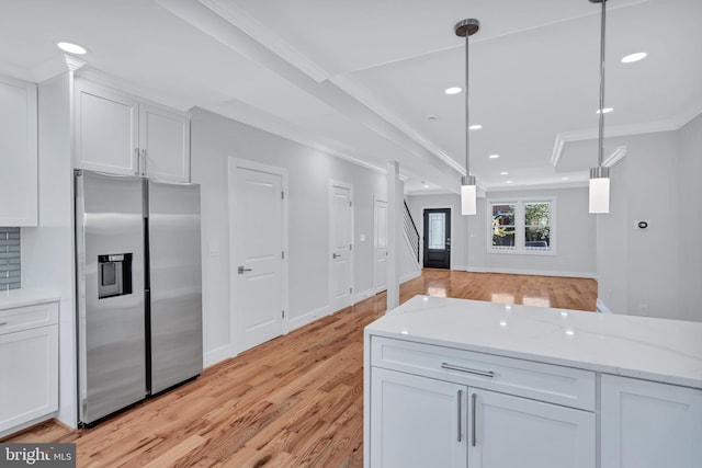 kitchen with light wood-style flooring, recessed lighting, stainless steel fridge with ice dispenser, white cabinets, and crown molding