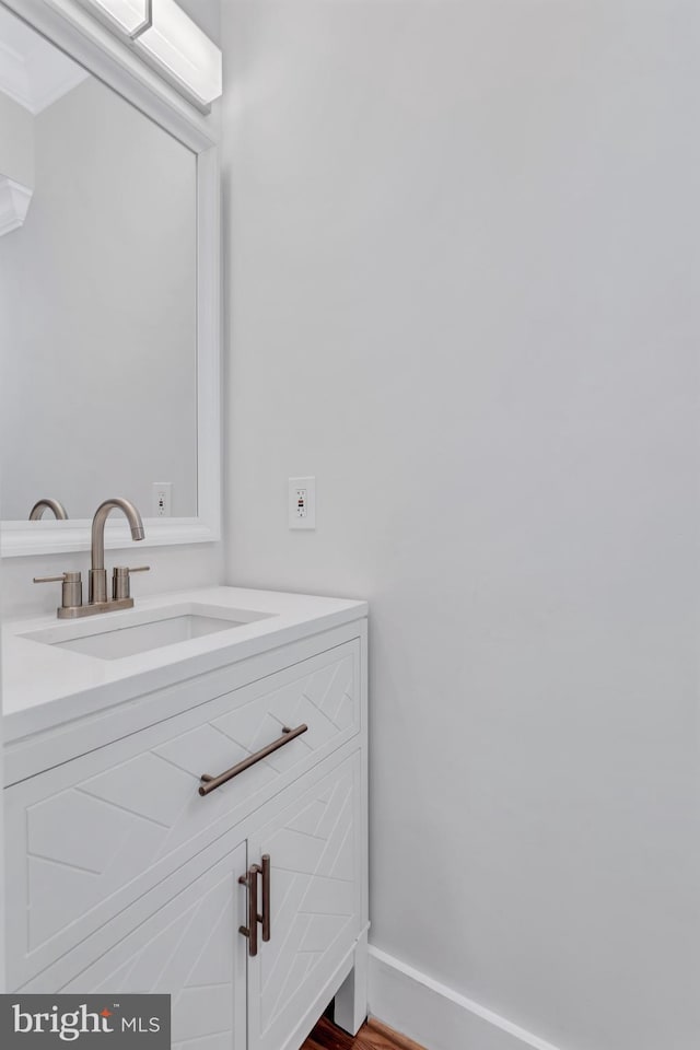 bathroom featuring vanity and baseboards