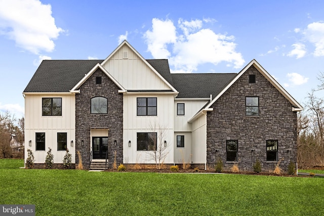 modern farmhouse style home with a front lawn, board and batten siding, and a shingled roof