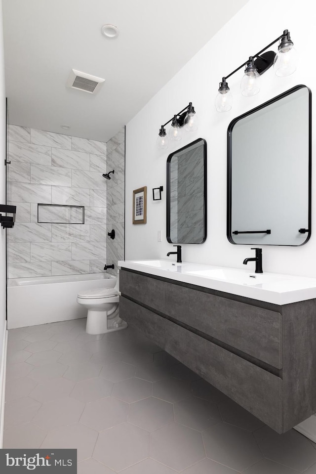 bathroom with visible vents, toilet, shower / tub combination, double vanity, and a sink