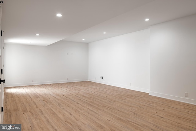 interior space with light wood-style flooring, recessed lighting, and baseboards