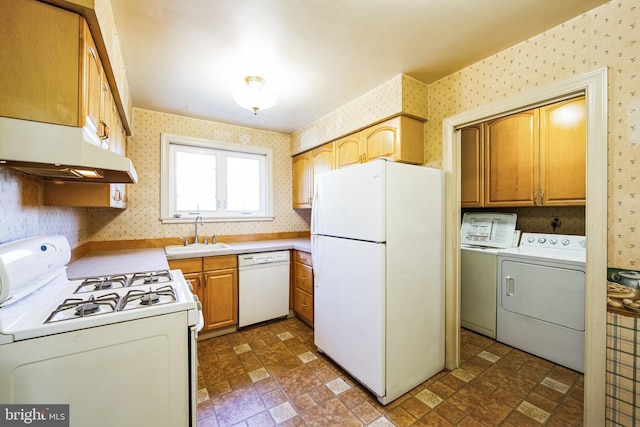 kitchen with wallpapered walls, white appliances, under cabinet range hood, and a sink