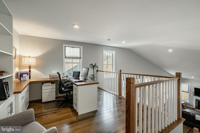 office space with recessed lighting, lofted ceiling, and dark wood-style floors