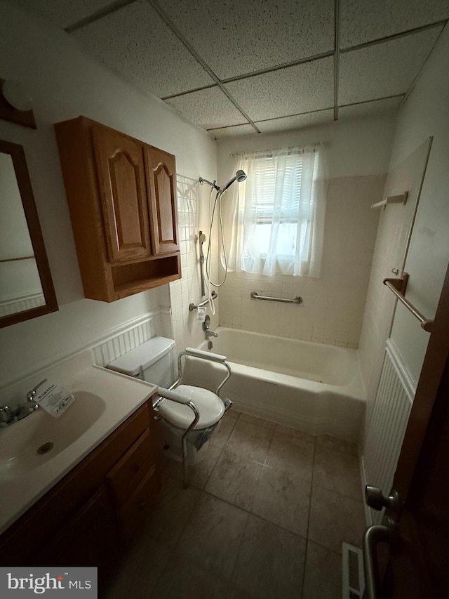 full bathroom featuring visible vents, toilet, shower / tub combination, a paneled ceiling, and vanity