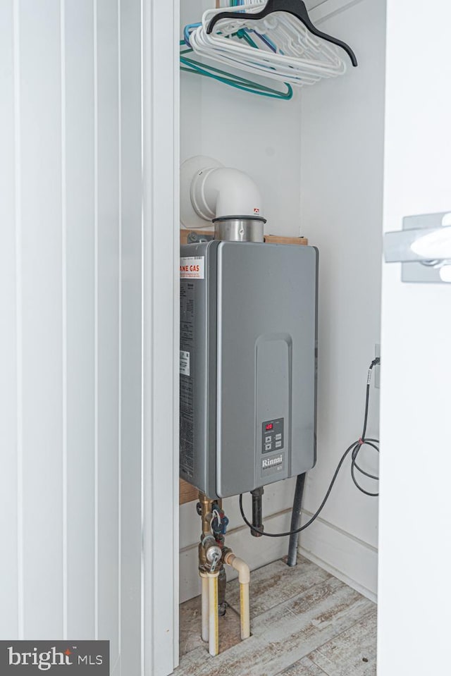 utility room featuring water heater