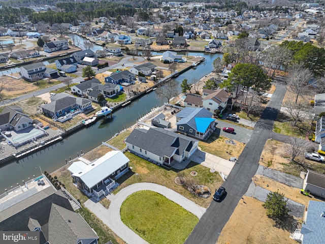 birds eye view of property featuring a residential view and a water view