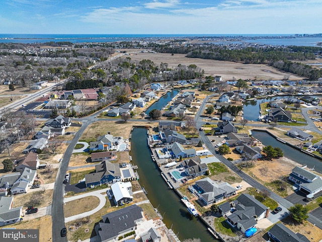 aerial view with a residential view and a water view