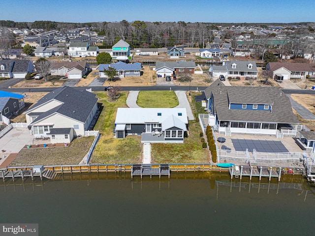 bird's eye view featuring a residential view and a water view