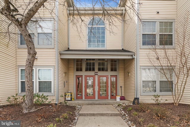 view of exterior entry featuring french doors