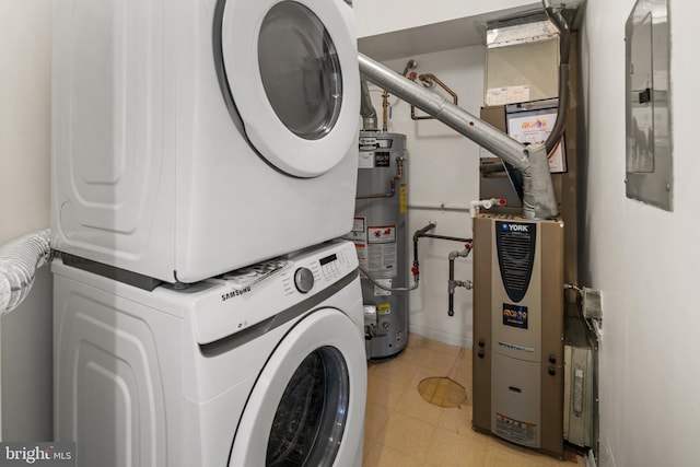 clothes washing area featuring stacked washer and dryer, electric panel, water heater, light floors, and laundry area