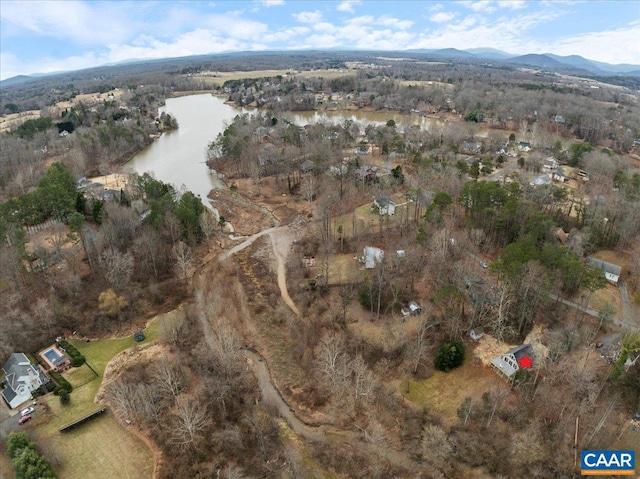 drone / aerial view featuring a water and mountain view