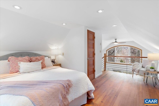 bedroom with recessed lighting, lofted ceiling, and hardwood / wood-style flooring