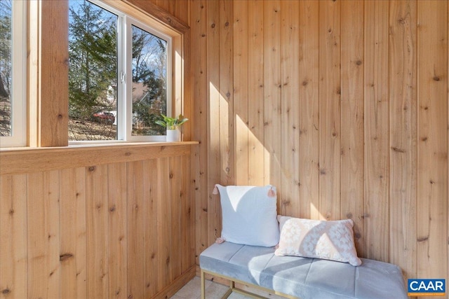 sitting room with wood walls