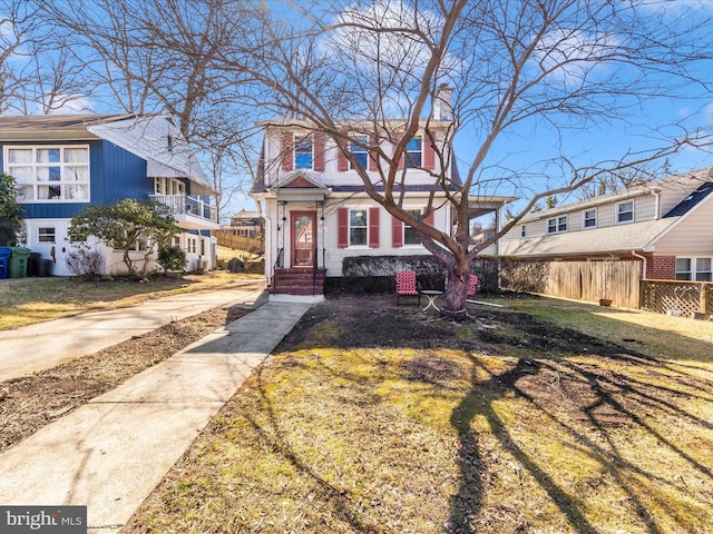 view of front of home with fence