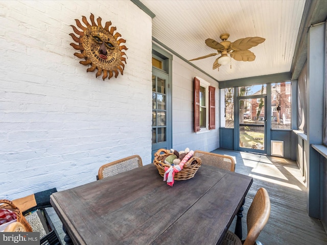 sunroom / solarium with wood ceiling and ceiling fan