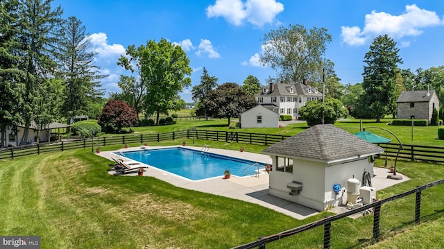 view of pool with a fenced in pool, a lawn, a patio area, and fence