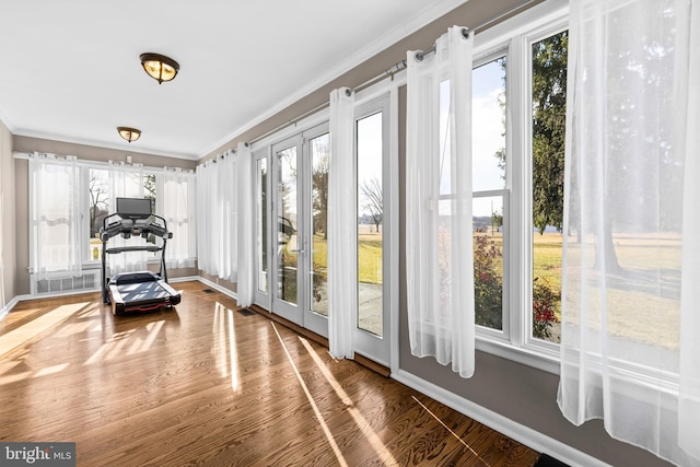 sunroom / solarium featuring french doors