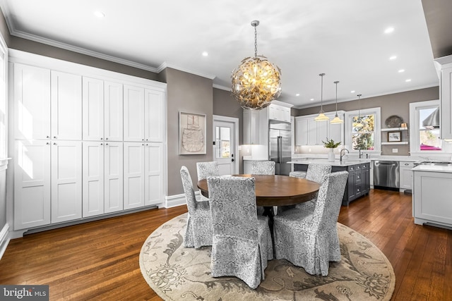 dining area featuring recessed lighting, a chandelier, dark wood finished floors, and ornamental molding