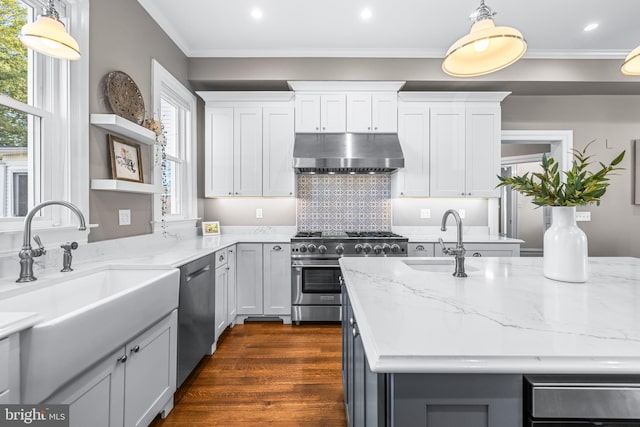 kitchen featuring open shelves, a sink, stainless steel appliances, under cabinet range hood, and crown molding