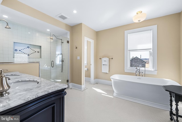 full bath featuring visible vents, recessed lighting, a shower stall, baseboards, and a soaking tub