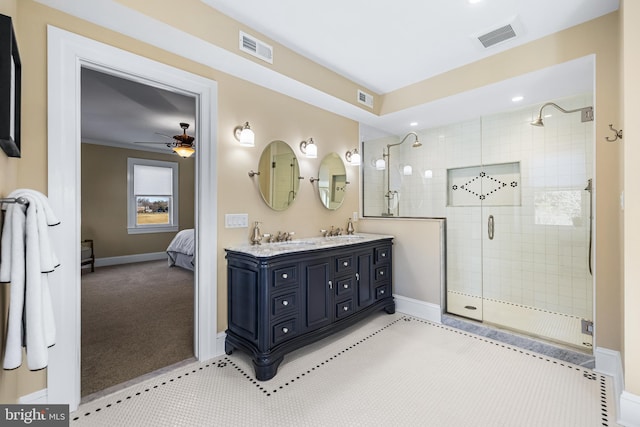 ensuite bathroom featuring a sink, visible vents, and a shower stall