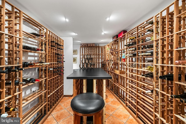 wine area with tile patterned flooring