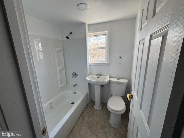 full bathroom with shower / bathing tub combination, toilet, and a sink