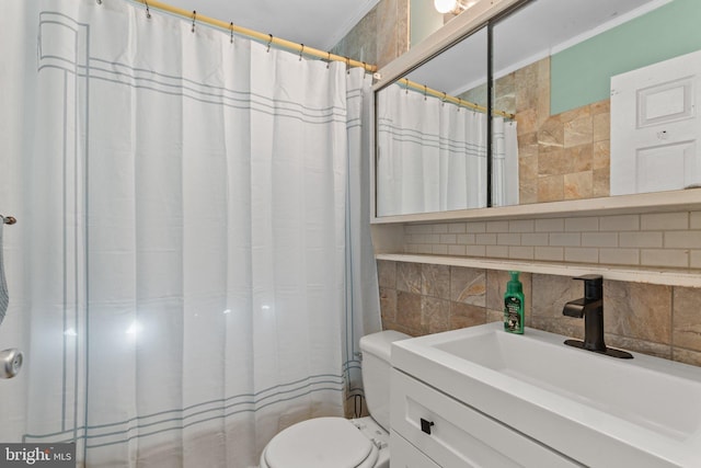 bathroom with tile walls, toilet, vanity, and a shower with curtain