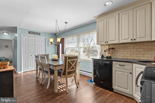 dining area with a chandelier, a baseboard heating unit, and dark wood-type flooring