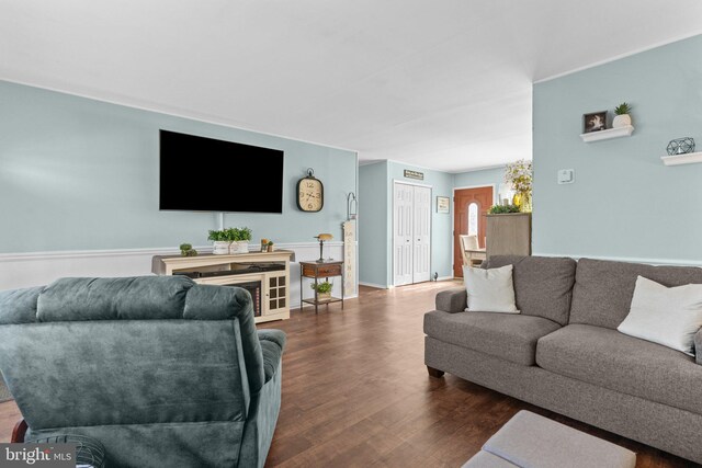 living room with dark wood-type flooring