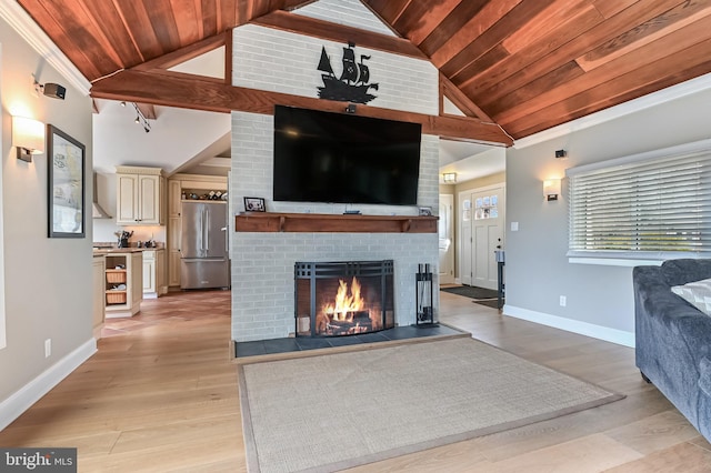 living room with baseboards, a brick fireplace, light wood-style floors, and wood ceiling