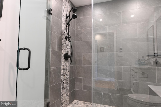 bathroom with a shower stall