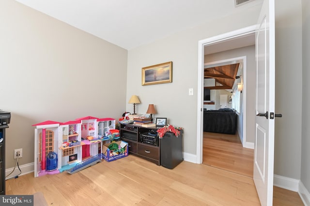 playroom with visible vents, baseboards, and light wood finished floors